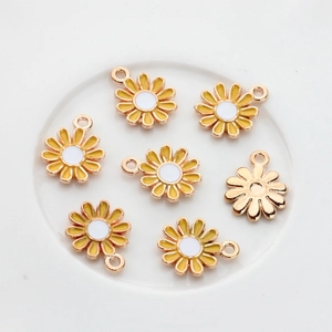 Detail of small yellow daisy flower alloy pendants for DIY jewelry making accessories