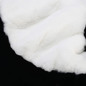 Close-up of premium white faux fur texture showing soft plush fibers and dense material