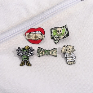 5pcs cartoon skull and dollar metal pins displayed on white canvas bag zipper
