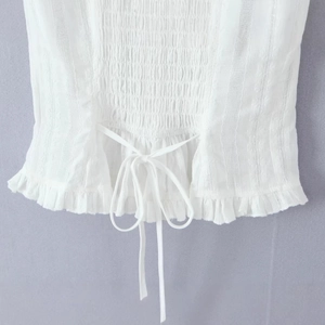 French style white smocked off-shoulder top with lace trim and bow tie detail