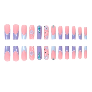 Pink and purple long square press-on nails with 3D floral accents and blue rhinestones