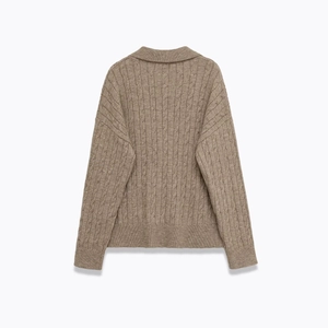 Women's long sleeve polo knit sweater in brown with textured cable knit patterns