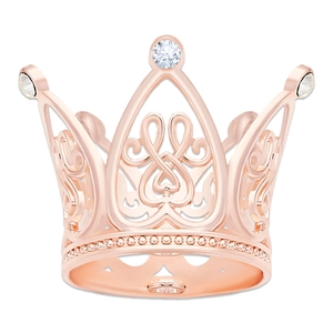 Detail view of rose gold crown ring featuring intricate hollow patterns and clear rhinestones