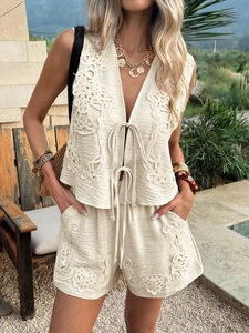 Beige embroidered two-piece vest and shorts set with V-neck tie-front in a vacation style