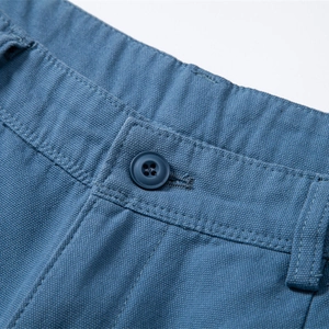 Navy cotton casual shorts with button fly detail and premium twill fabric texture