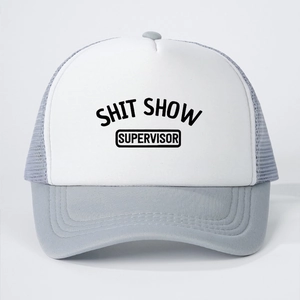 Detailed front view of grey and white trucker hat with Shit Show Supervisor text