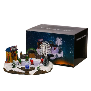 Animated Christmas village hockey scene with glowing lights and gift box display