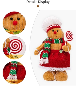 Detail display of Christmas gingerbread man doll featuring chef hat and red skirt