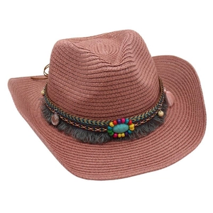 Close-up of ethnic western cowboy straw hat with turquoise and beaded band