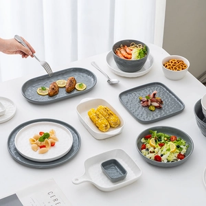 Minimalist French style ceramic dinnerware set including grey and white textured plates and bowls