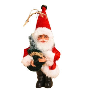 Standing Santa Claus doll in classic red suit holding a small Christmas tree bag
