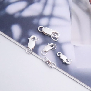 Macro view of five silver S925 sterling silver square spring clasps for DIY jewelry