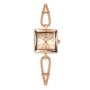 Close-up of rose gold square watch face with chain bracelet and GEDI logo