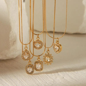 Set of 18K gold stainless steel necklaces with geometric crystal heart pendants on stones