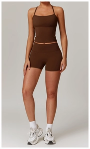 Detail of dark brown brushed yoga tank top and high waist shorts with matte texture