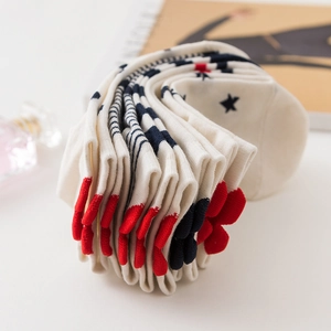 Cute white cotton ankle socks with navy stripes, star patterns and 3D plush accents