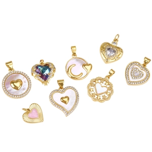 Detailed view of gold plated shell heart pendants with cubic zirconia for jewelry DIY