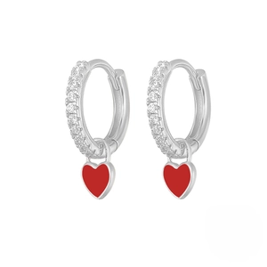 Sparkling silver huggie earrings with white zircons and a vibrant red heart pendant