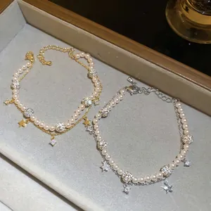 Elegant double-layered pearl bracelet with star charms and pavé crystal beads for women