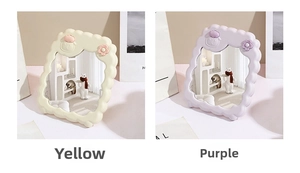 Detail view of yellow and purple cartoon desktop makeup mirrors with wave edges