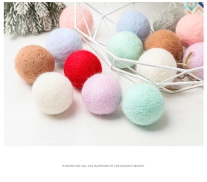 Close-up of colorful wool felt balls for Christmas DIY crafts and holiday tree decorations