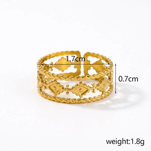Macro shot of gold hollow ring with beaded details and adjustable open band design