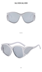 Detail view of silver Y2K oversized sunglasses with futuristic matte metal frames