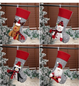 Detailed view of 4-pack Christmas stockings featuring Santa, snowman, elk and penguin