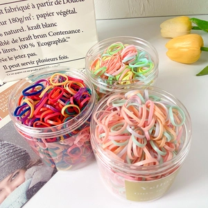 Three-pack of colorful high-elasticity hair bands for kids in transparent containers