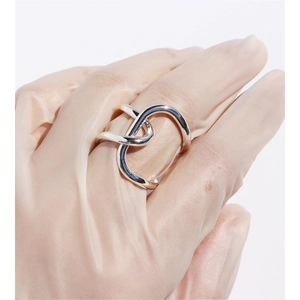 Silver wide knot interlocking ring for women featuring abstract chunky metal lines
