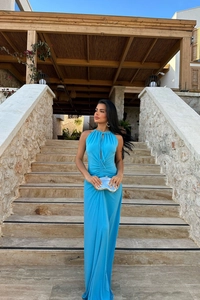 Detail of blue halter maxi dress featuring ruched drawstring and chest cutout detail