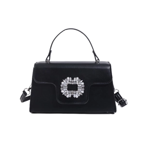 Elegante bolso de mano negro con hebilla de flor de cristal y correa ajustable