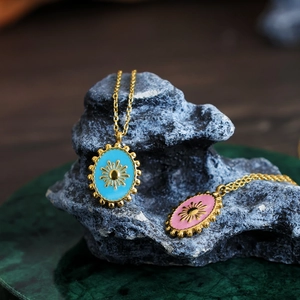 Bohemian gold titanium necklace with sun pattern enamel pendant on grey stone