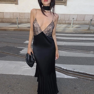 Detail of elegant black satin slip dress with beige lace splicing and matching choker
