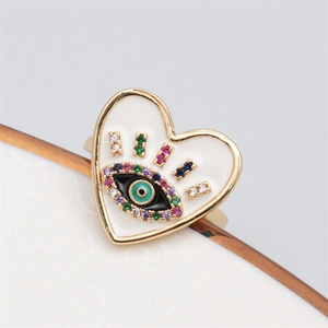 Detail of gold-plated heart evil eye ring with colorful cubic zirconia and enamel