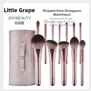 Detailed 10-piece makeup brush set with rose gold handles and pink leather storage bag