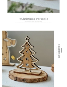 Detail of laser-cut wooden Christmas tree ornament with a star topper on a round base