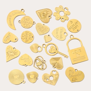 Golden stainless steel charms in heart, moon, and key shapes with engraved messages