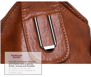 Close-up of reinforced handle stitching and metallic hardware on brown leather tote bag