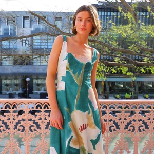 Detailed close-up of French vintage floral print dress on a model in sunlight