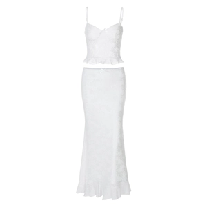 Detailed view of white floral lace texture and ruffled hem on a bodycon maxi dress