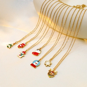 Christmas necklaces collection with gold pendants featuring snowman, reindeer and tree