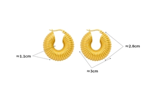 Detailed view of chunky gold twisted hoop earrings with 1.1cm width and 2.8cm height