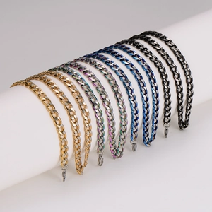 7mm stainless steel Cuban chains in gold, rainbow, blue, and black on a display