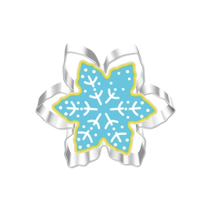 Macro shot of snowflake cookie cutter made of stainless steel with blue decorative pattern