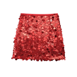 Detail of red mini skirt with high-density large round sequins and metallic party texture