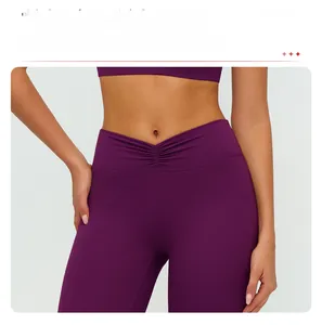 Detail showing the purple V-shaped ruched high waistband for tummy control on sports leggings