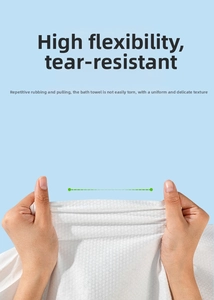 Close-up of a white waffle-textured disposable towel showing durability and tear resistance