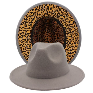 Elegant grey fedora hat with unique leopard print lining and classic wide brim style
