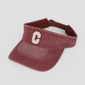 Detail of burgundy washed denim visor hat featuring a premium white embroidered letter C